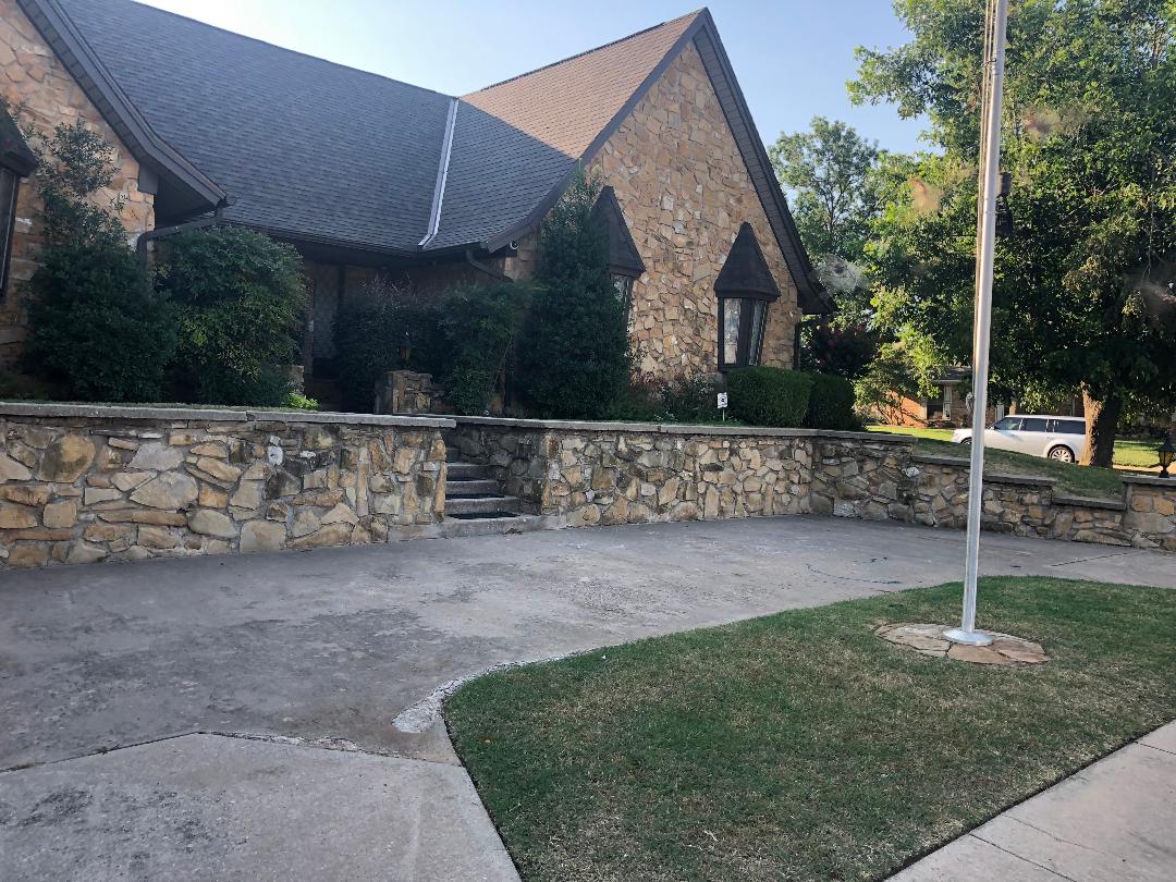 Stone building with driveway and flagpole