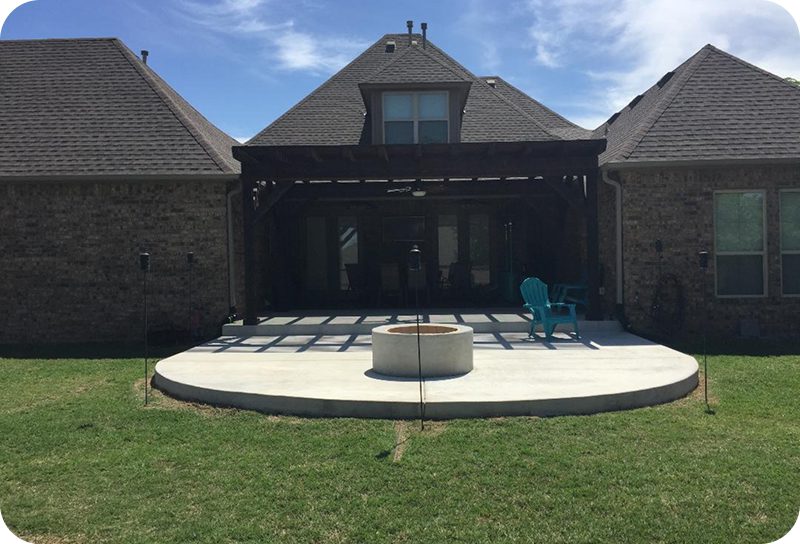 Brick house featuring a covered patio