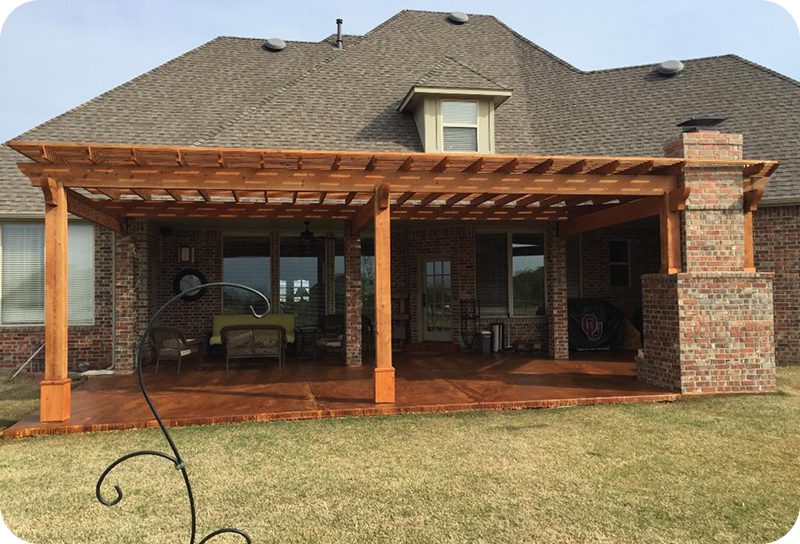 Backyard patio with wooden pergola